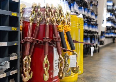 Come-along hand winches for lifting and pulling heavy loads, shown inside a PT Hose & Bearing store.