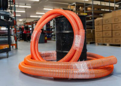 Mud line hose for fluid circulation in oil and gas drilling, shown in the warehouse at PT Hose & Bearing,