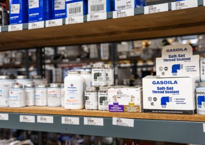 Pipe thread sealant for leak-proof connections, shown on the shelf at PT Hose & Bearing.