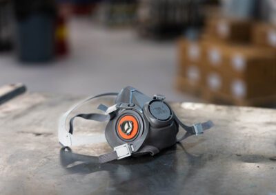 A respirator is shown atop at metal workbench at PT Hose.